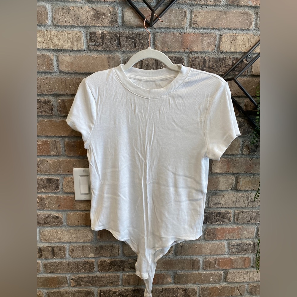 Brand new missing tags. A new day size large white bodysuit.